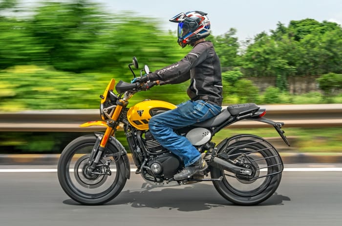 Triumph Scrambler 400 XC left side profile riding shot Triumph Scrambler 400 XC left side profile riding shot